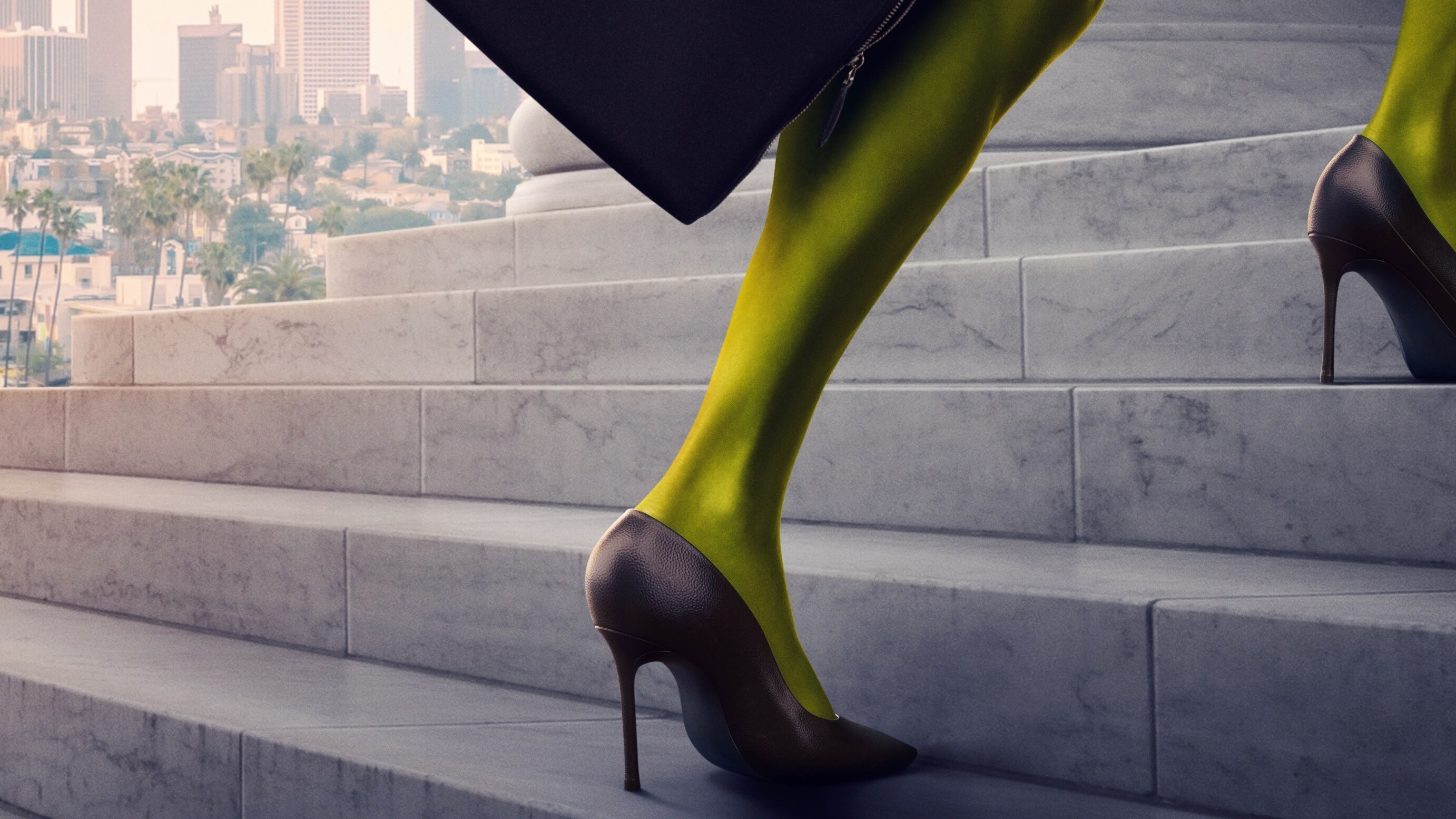 An image of a green leg in a high heel ascending the steps of a courthouse. Downtown LA is in the background.
